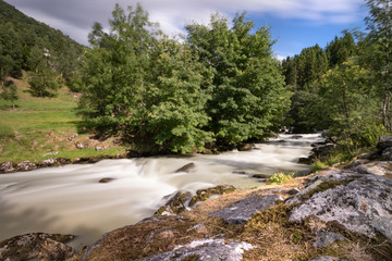 Fototapeta na wymiar View of the river Geirangerelvi on the way to the waterfall Storfossen in Geiranger, Norway.