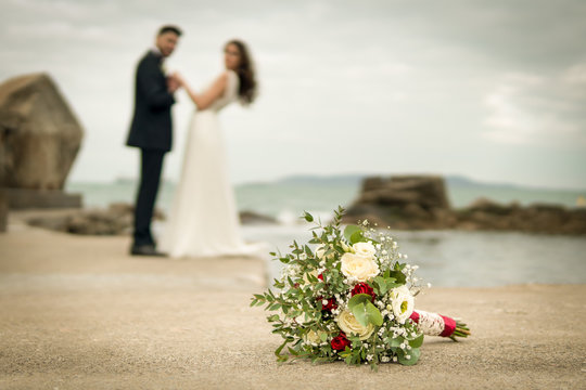 Young Couple Bride Groom Getting Married Wedding Posed Photos At Seaside Sea Beach Hairpiece Flowers Bouquet Church