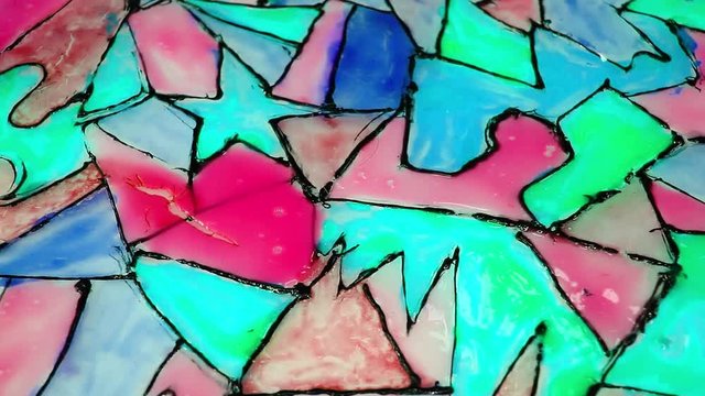 Children hobby glass paint window decor looping texture pattern closeup video