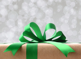 Closeup of a Wrapped Christmas Present with green ribbon and bow