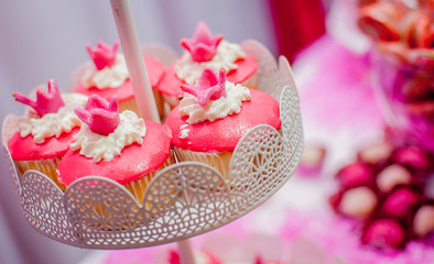 cup cake with pink cover served in decoration metal tray