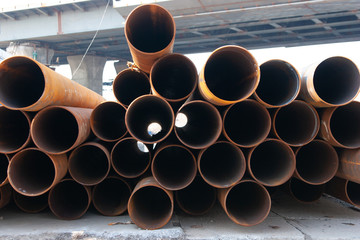 iron pipes are put on a building site 