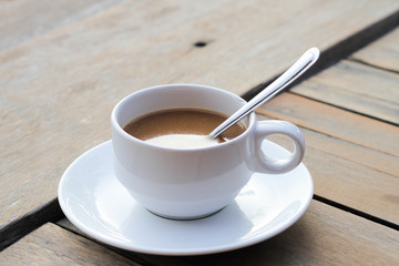 cup of coffee on the wooden table