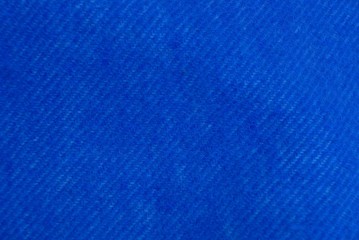 Obraz na płótnie Canvas blue fabric texture of woolen fabric from a piece of clothing