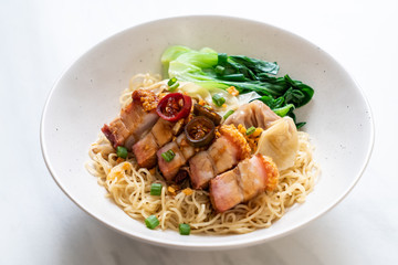 egg noodle soup with crispy pork belly and wonton