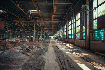 Ruins of abandoned factory or warehouse, large creepy and empty industrial constriction