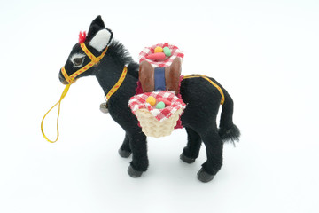 Donkey with saddle soft toy(doll) isolated on white