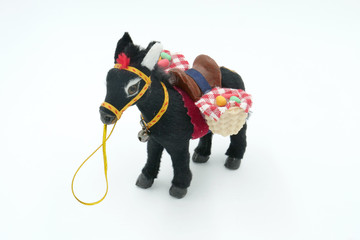 Donkey with saddle soft toy(doll) isolated on white