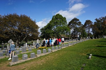 Halifax, Nova Scotia, Canada: Visitors view the graves of 150 victims of the sinking of the RMS Titanic on April 14, 1912, at Fairview Lawn Cemetery.