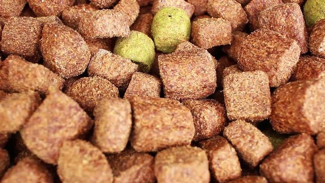 Dog food dry grains pet foods looping texture pattern closeup video