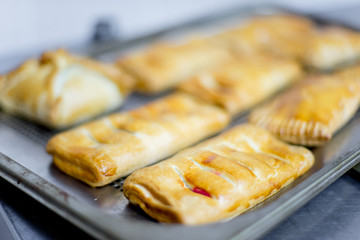 different kinds of pastry are being cooked
