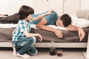 Little Boy Sitting in Room with Drunken Father.