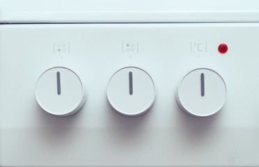 white electric burner switches