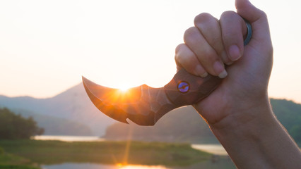 Knife in the hands, karambit knife tactical fighter, self defense Martial Arts Fighting