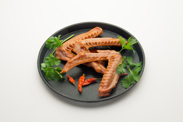 Duck head on a plate isolated on white