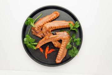 Duck head on a plate isolated on white