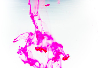Obraz premium a drop of paint pouring in water