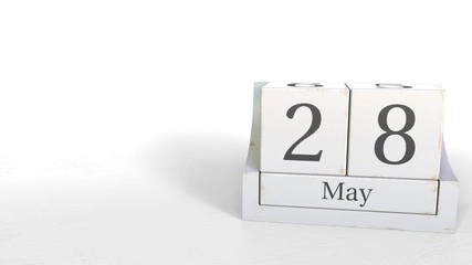 Wood cube calendar shows May 28 date, 3D animation