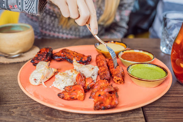 Indian cuisine-Famous Indian mutton or lamb curry dish in a cast iron cookware. Selective focus photograph