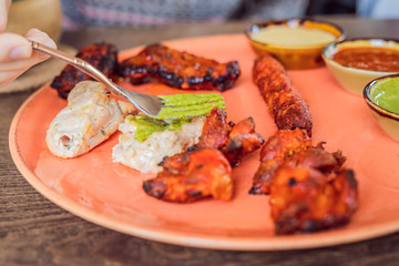Indian cuisine-Famous Indian mutton or lamb curry dish in a cast iron cookware. Selective focus photograph