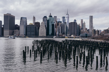 Fototapeta na wymiar View of the Manhattan skyline from Brooklyn Heights, New York. Cloudy spring day