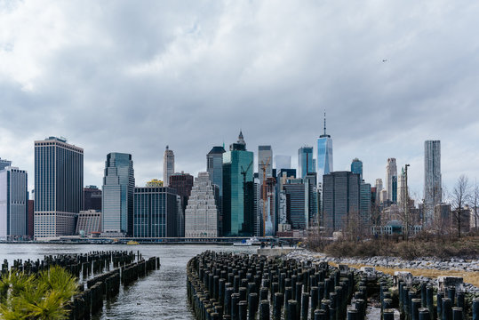 View of the Manhattan skyline from Brooklyn Heights, New York. Cloudy spring day