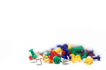 Colorful pushpins isolated in white background. Office accessories with copy space.