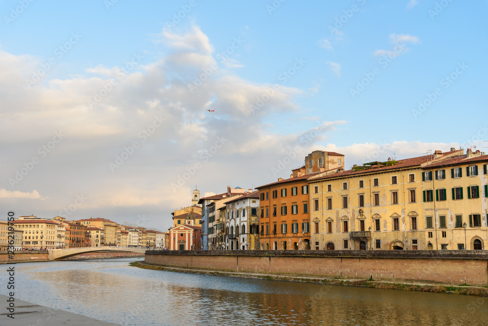 Wall mural view on embankment of arno river and bridge ponte di mezzo. pisa, italy