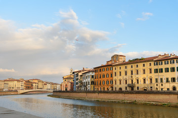 View on embankment of Arno river and bridge Ponte Di Mezzo. Pisa, Italy