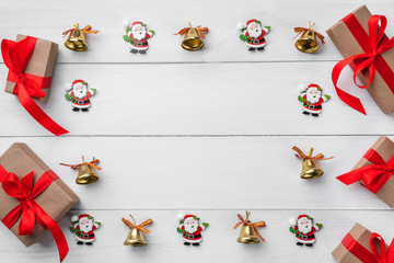 Christmas card with santa on white wooden background, space for text. Xmas and happy new year card. Top view, flat lay.