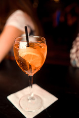 Classic Manhattan alcoholic cocktail served in a glass with a slice of orange peel