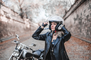 Fototapeta na wymiar Beautiful woman with motorcycle outdoor. 