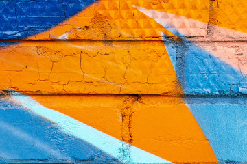 Graffiti painted on a brick wall texture.