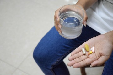 Water and medicines in the hand