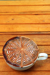 Fototapeta na wymiar Hot coffee latte on wooden background for background decoration.