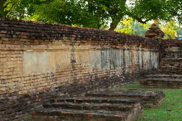 Fototapeta na wymiar Old temple wall in Thai temple (Wat Thai) Phichit historian park ,The landmark in Phichit province Thailand