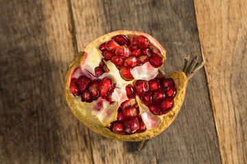 Pomegranate fruit on wooden background