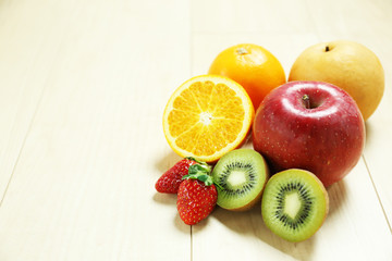 mixed fruits on wood table
