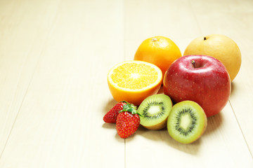 mixed fruits on wood table