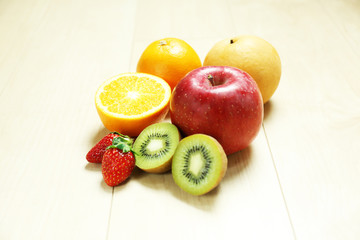 mixed fruits on wood table