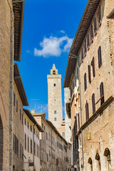 Fototapeta na wymiar Medieval Street Stone Cuganensi Tower San Gimignano Tuscany Italy