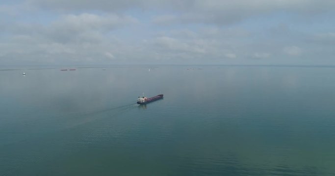 4K video. The cargo ship departs from the Bautino trading port and goes to the Caspian Sea.