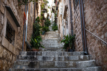 Narrow medieval alley with stairs upin Dubrovnik in winter, Croatia