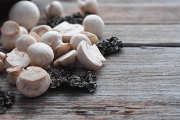 white mushrooms on a wooden table
