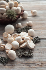 white mushrooms on a wooden table