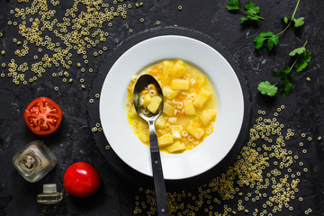 soup, vegetable, pasta and vegetables - the first dish  (dark background). vegan food. top view. copy space