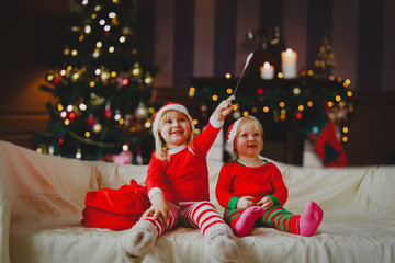 Kids enjoy christmas celebration, getting presents at home