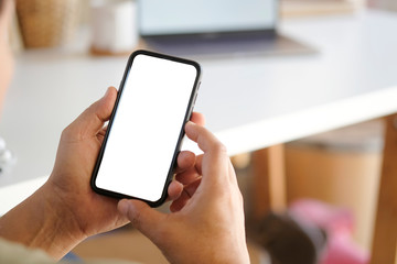 Man hands holding smart phone with blank copy space screen for your text message or information...