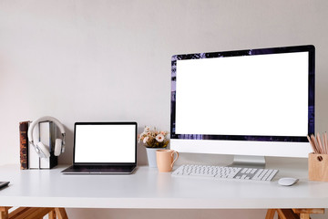 Workplace mockup concept. Mock up home decor desktop computer and laptop with vintage books, flower. Copy space for products display montage.Mockup desktop.