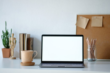 Workplace mockup concept. Selective focus Mockup home decor laptop computer and office object with copy space for products display montage.Mockup desktop